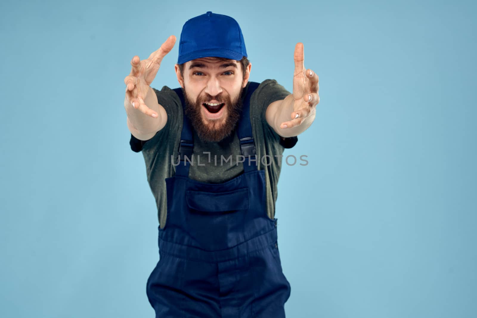 Man in working uniform emotions in life delivery service work. High quality photo