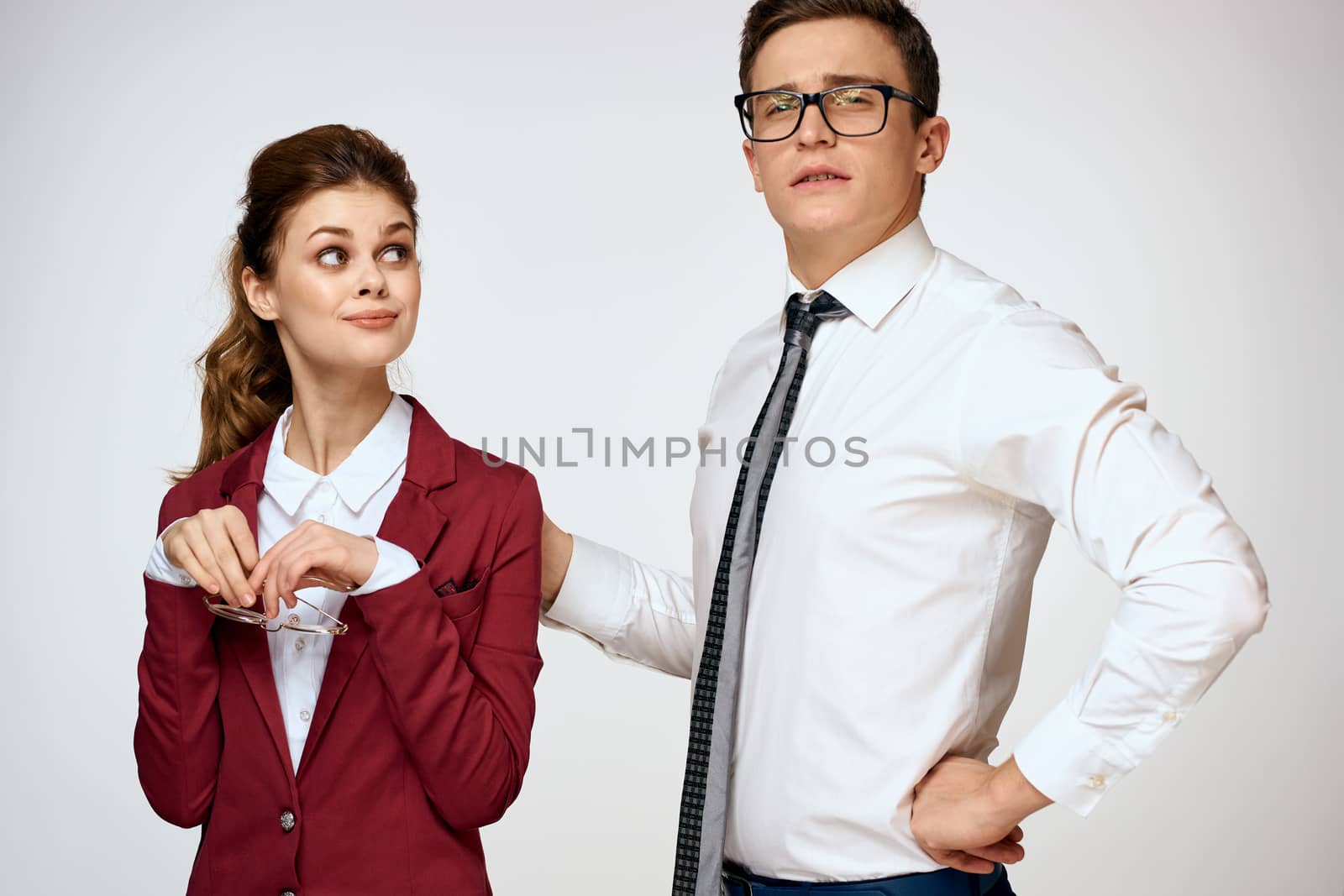Work colleagues Business couple office officials team studio light background. High quality photo