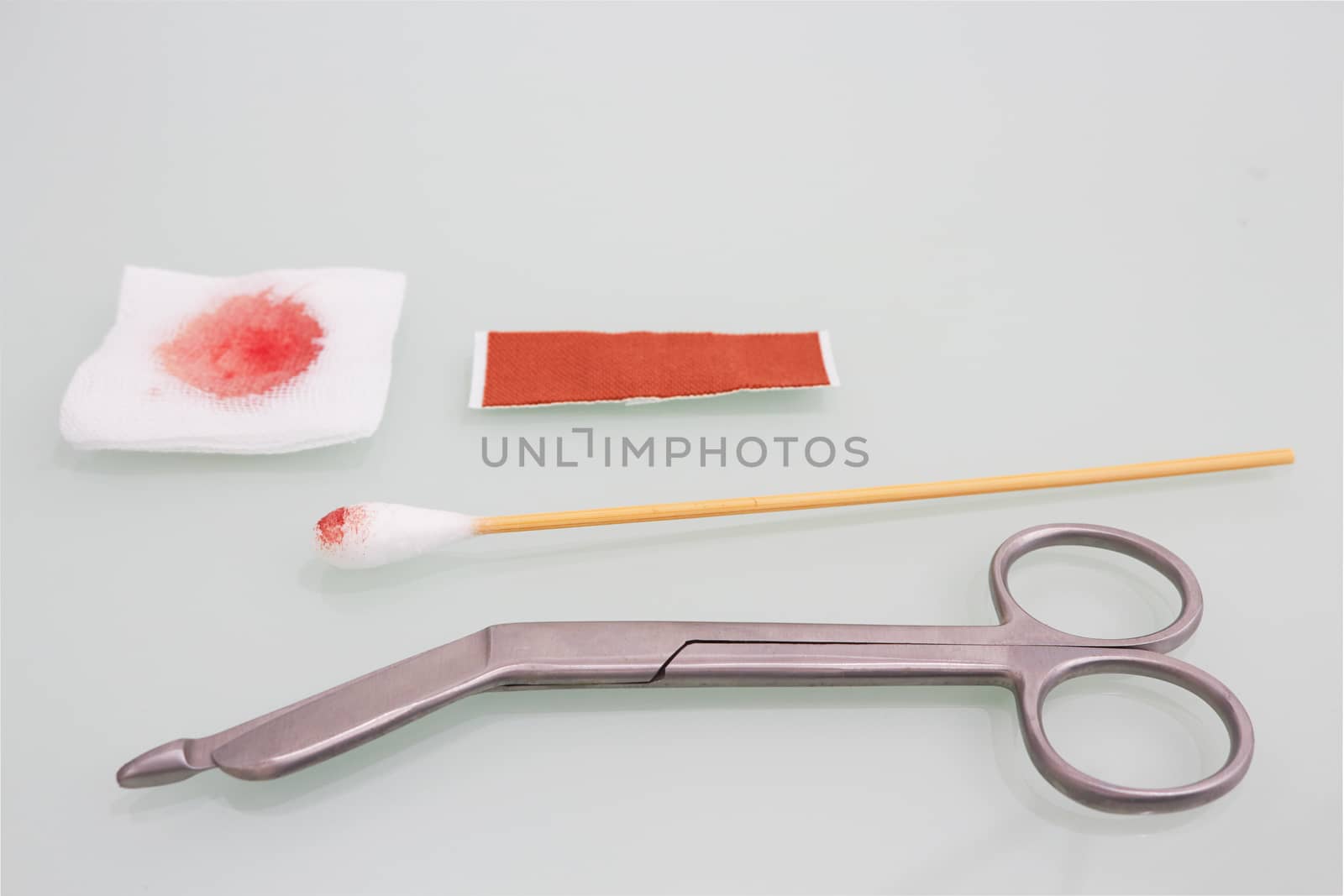 Guaze cutting scissors blood gauze ,swab and plaster on copy space