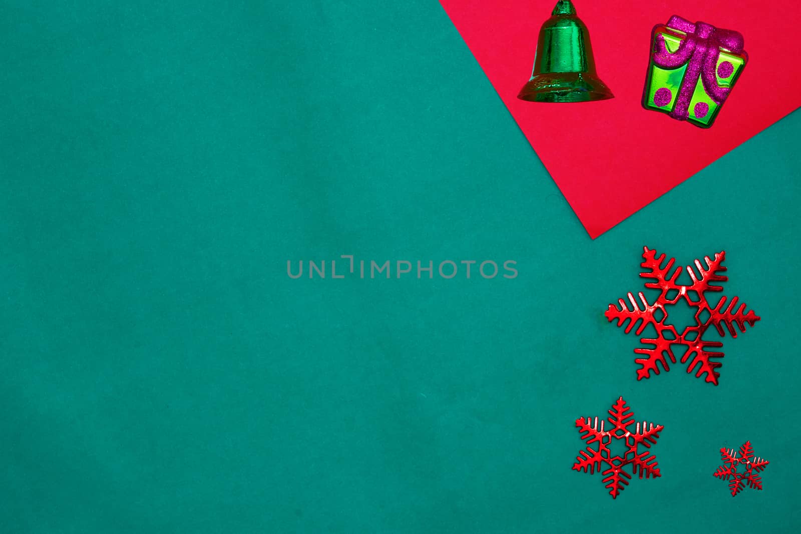 Green bell ,snow flakes and star on red and green background with copy space for new year and christmas time