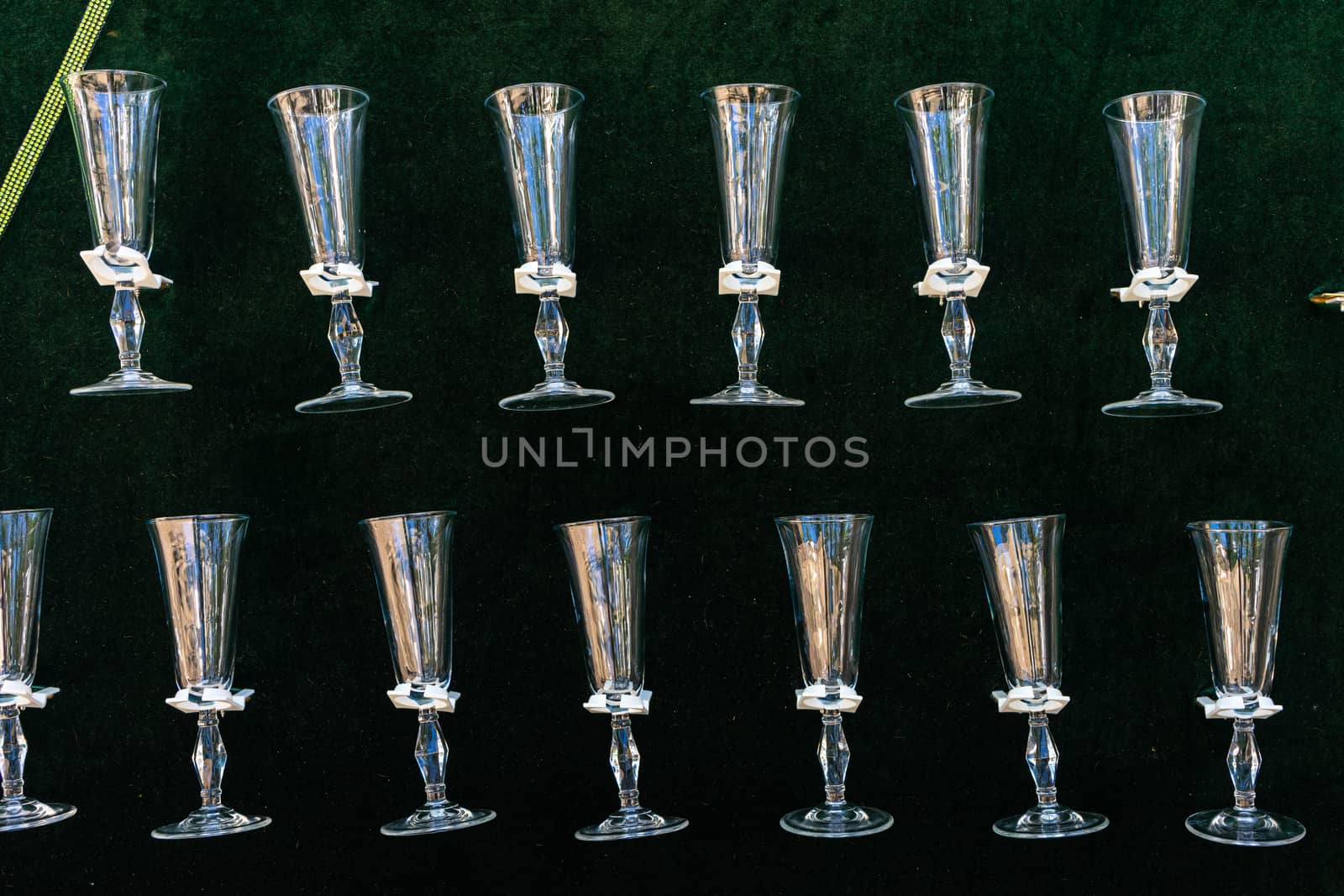 Empty drink glasses are attached to the wall. Buffet table. Decoration for the holiday.