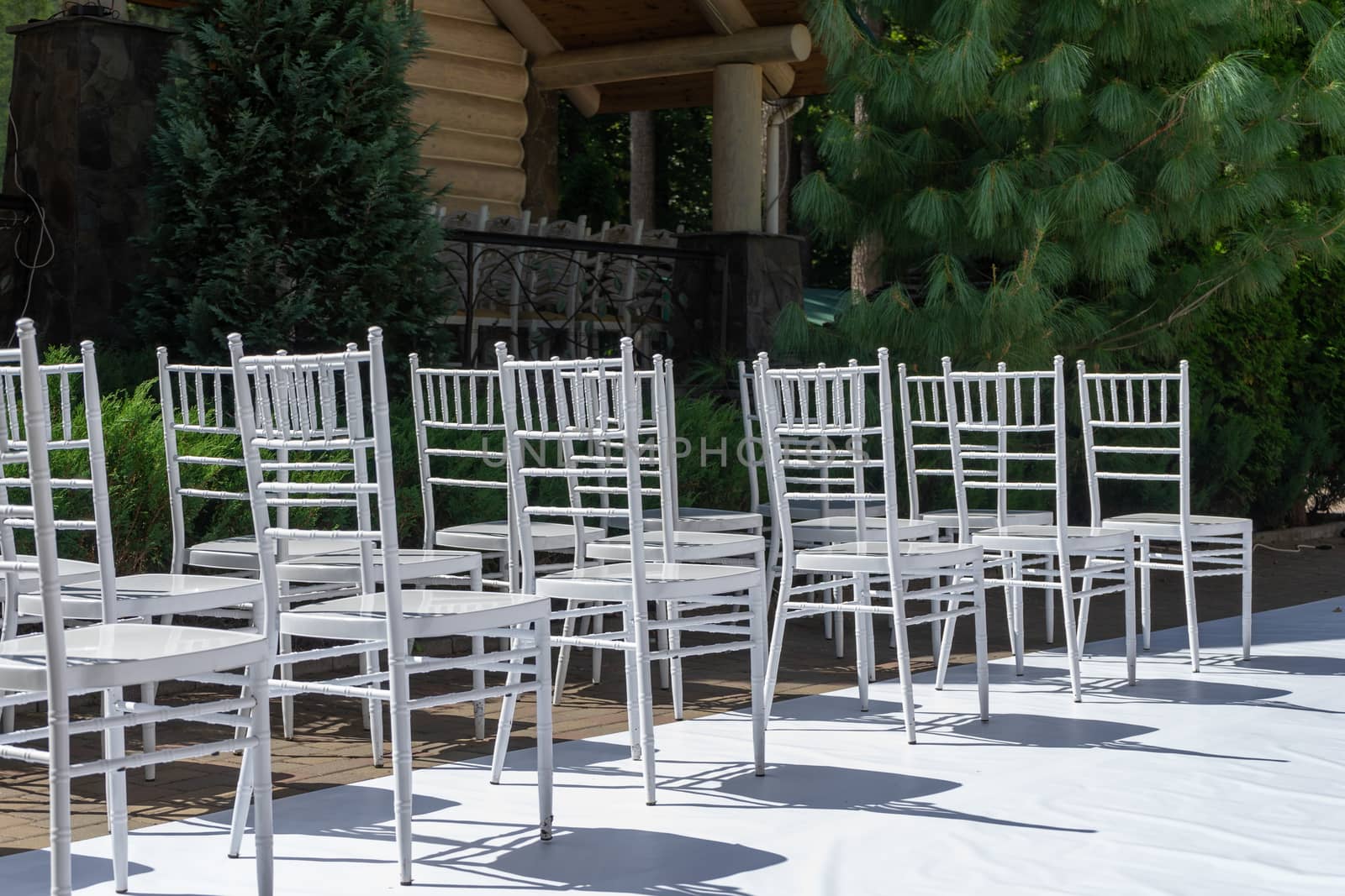 White wooden chairs. Wedding ceremony. by Serhii_Voroshchuk