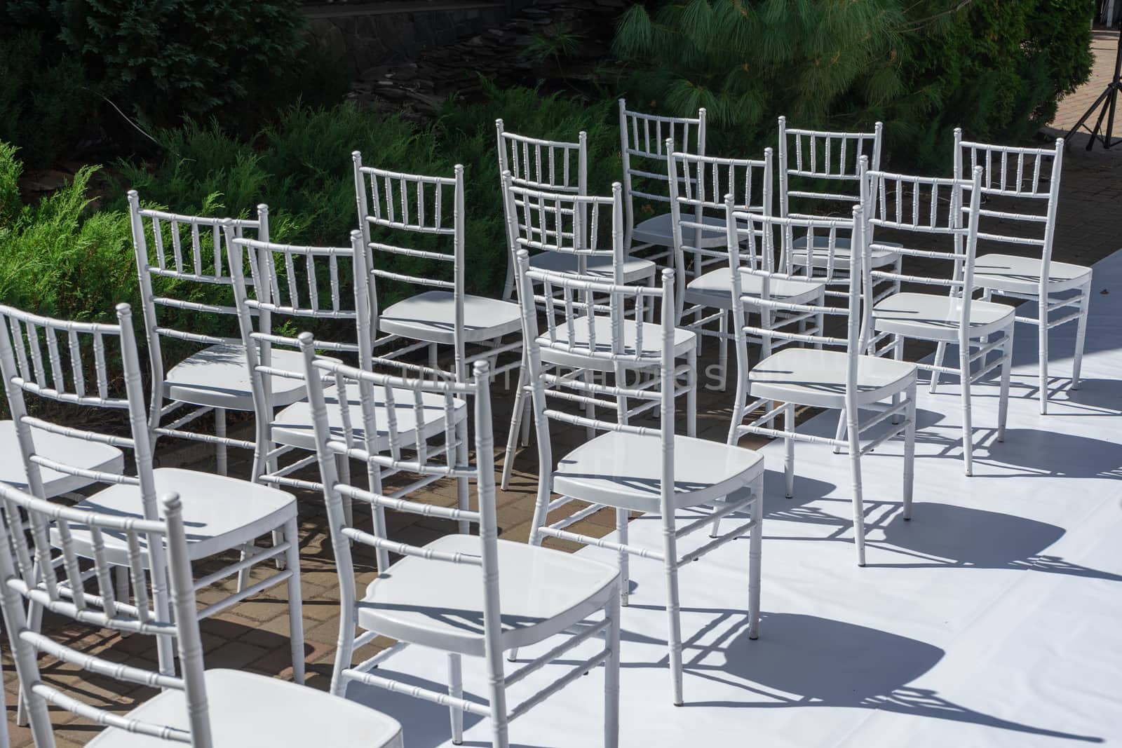 White wooden chairs for festive events. Wedding ceremony. Marriage registration.