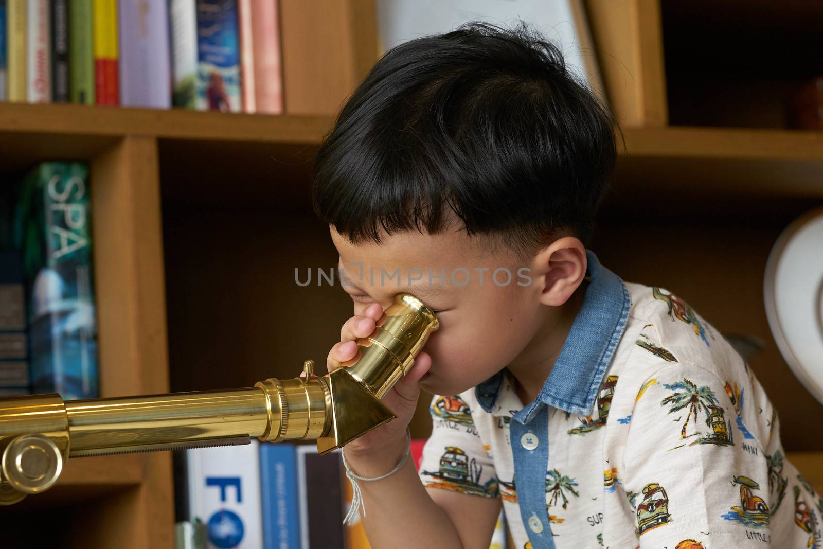 kid or boy use telescope alone