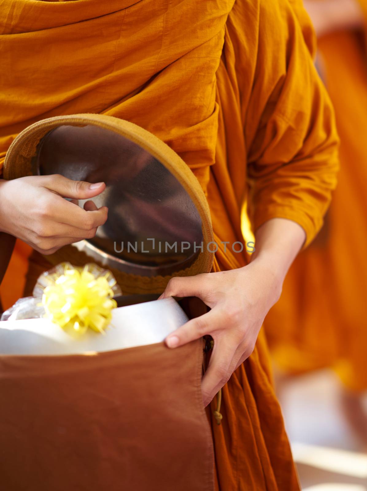 monk is offered food by buddist