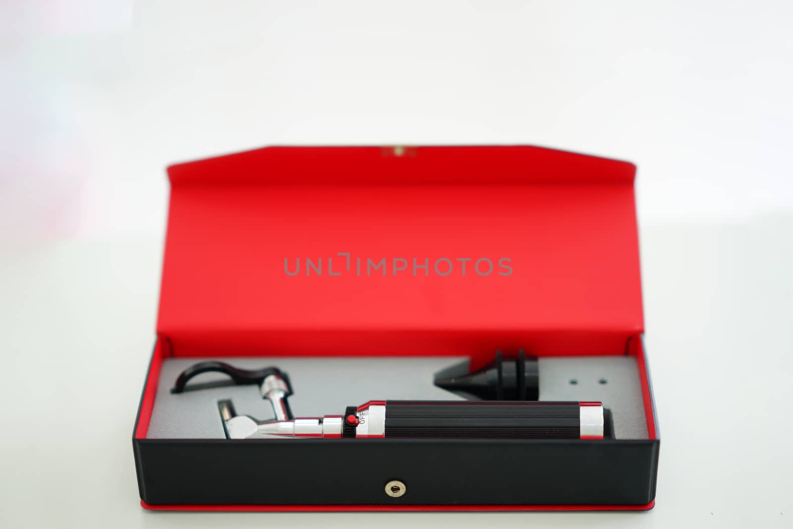 Otoscope for ear check for doctor ENT in block box on blur background
