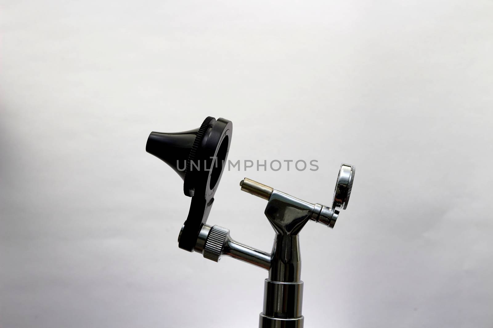 Otoscope for ENT doctor exam ear head cone piece view on white background