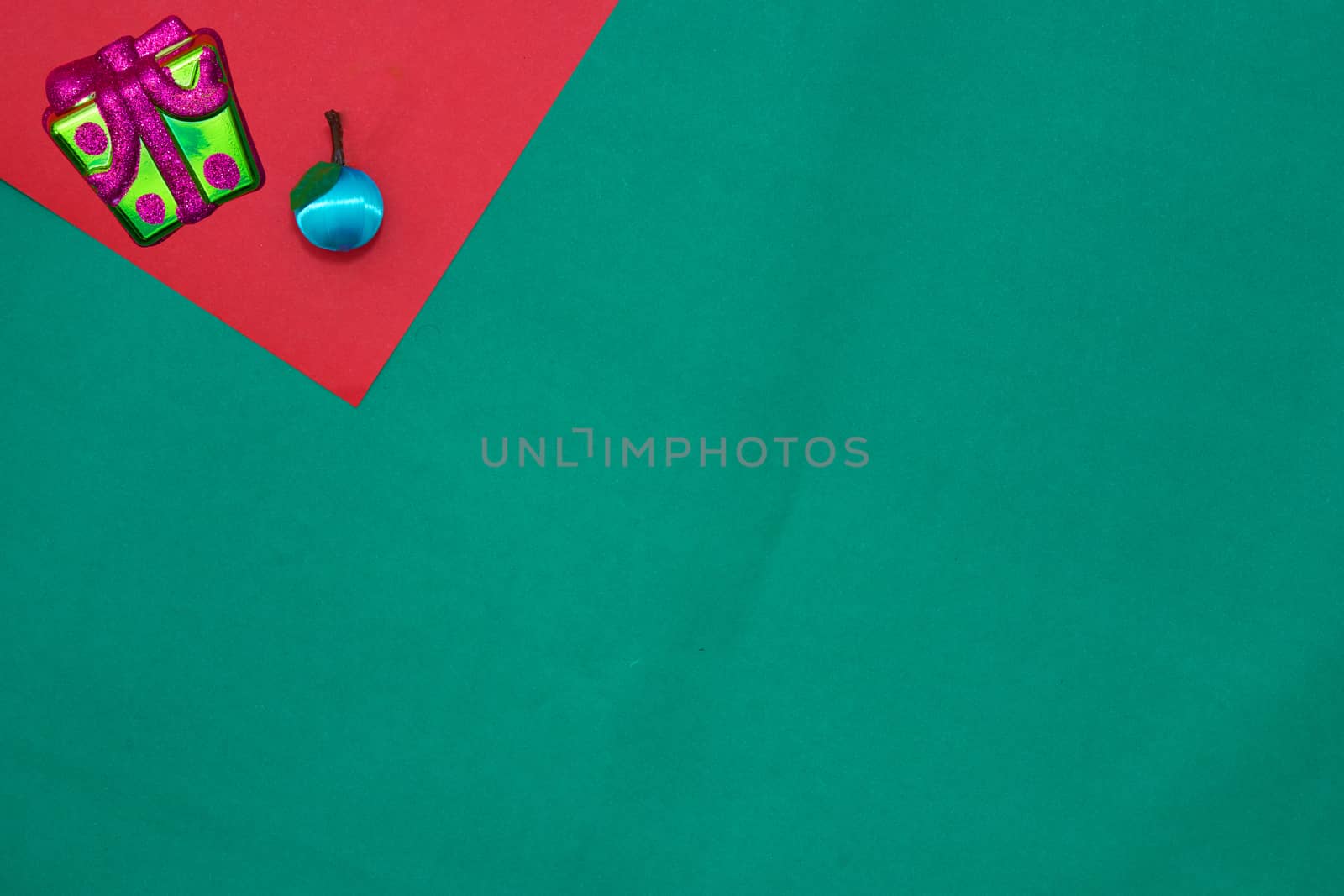 Present  box  and fruit on red and green background with copy space for new year and christmas time
