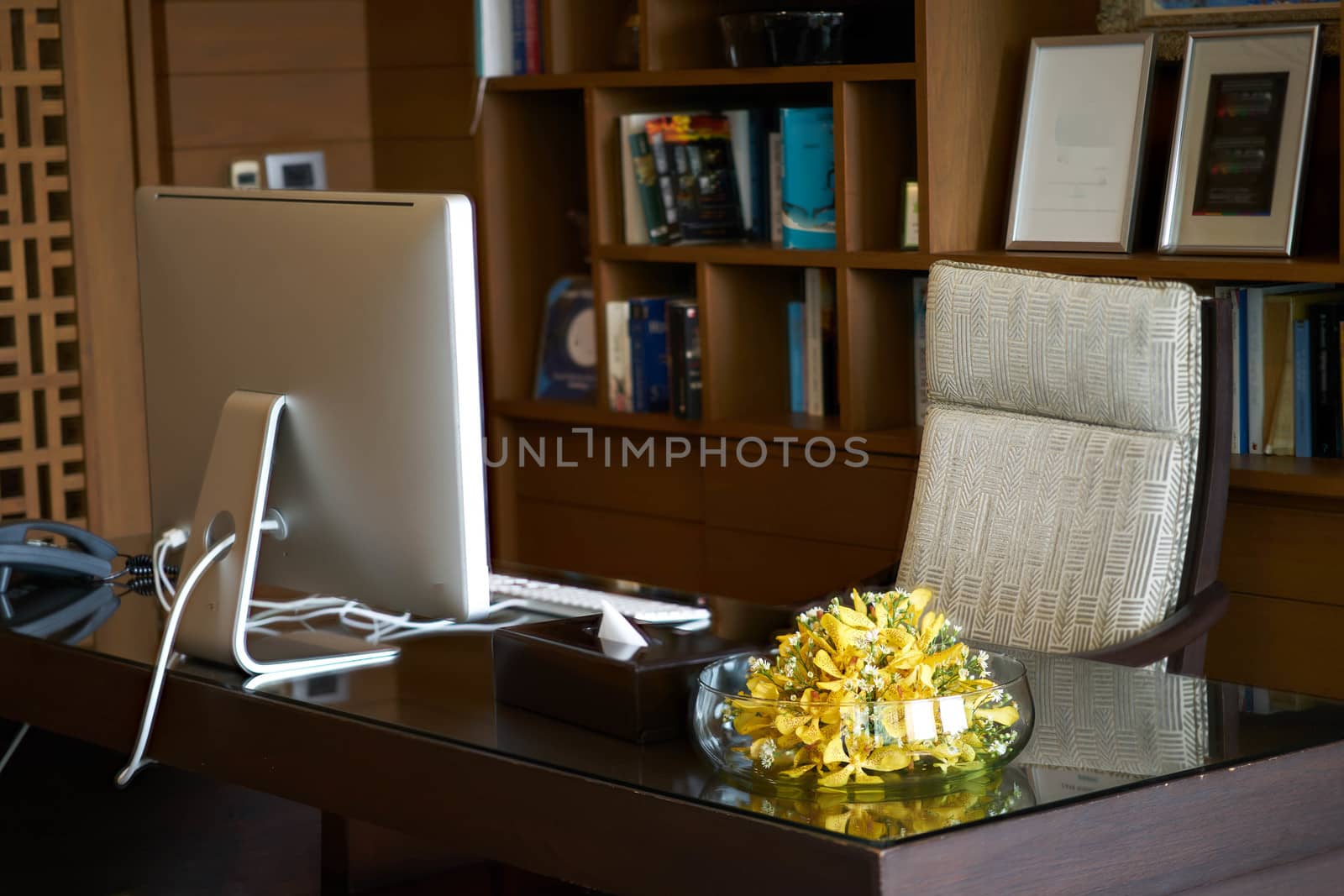 Room office of Manager or headmaster include computer armchair vase.