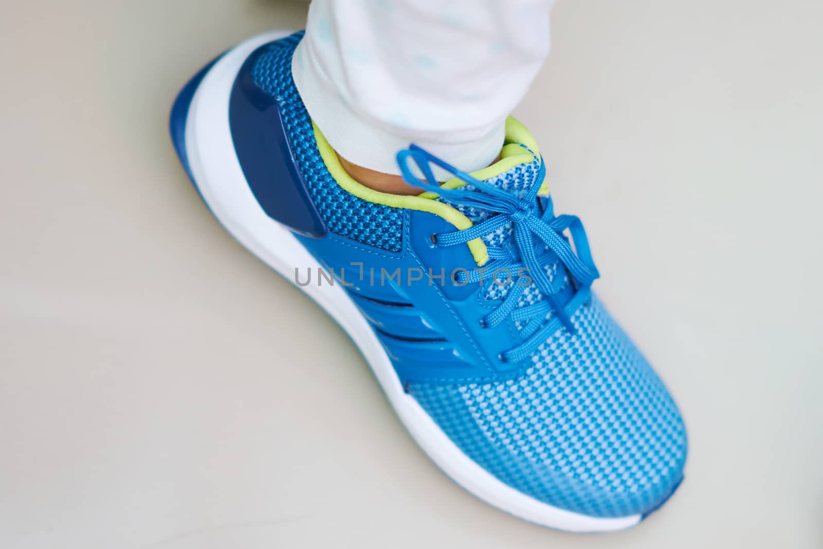 Sport or sneaker blue shoes on wear ing single