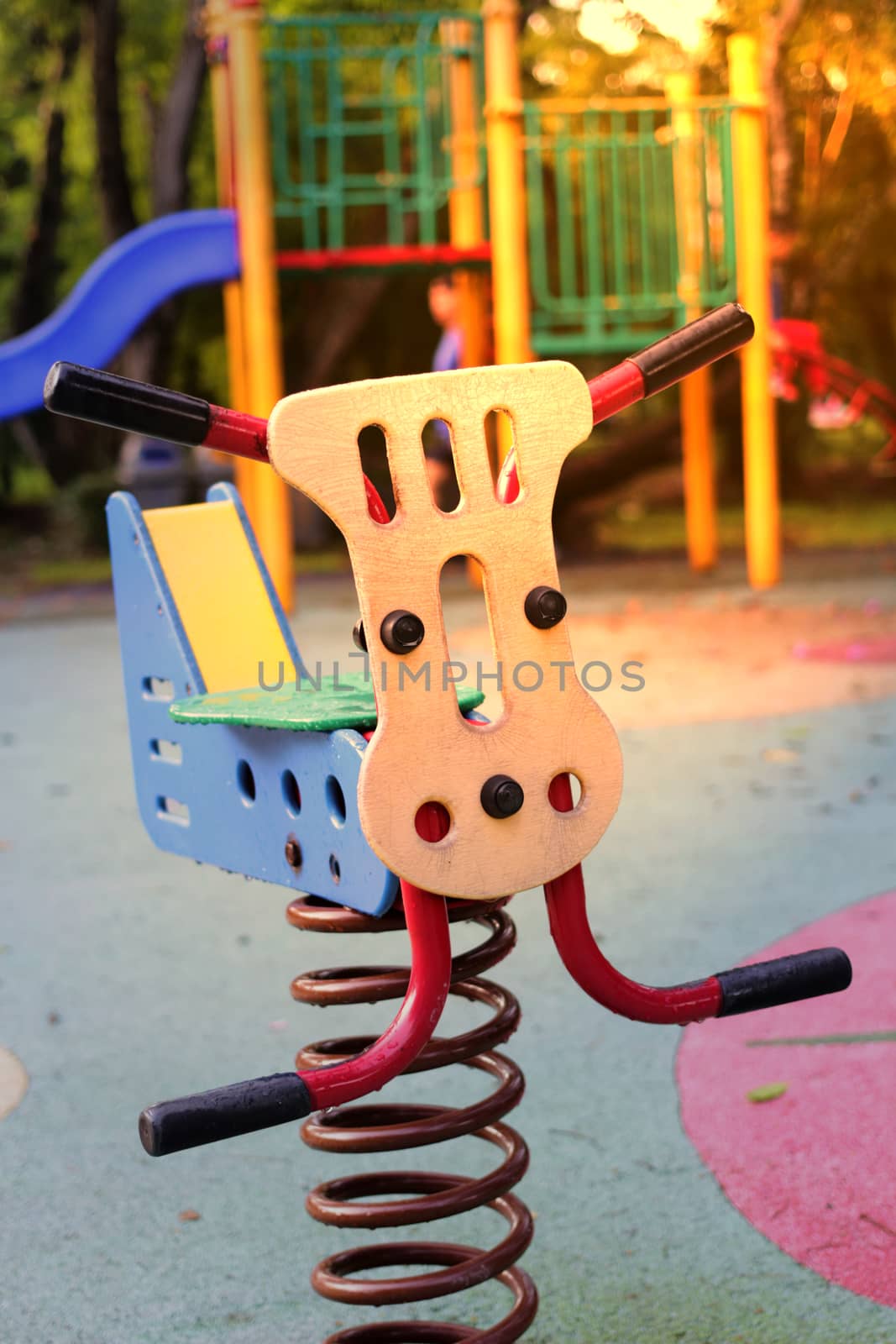 see saw toy in public playground in park on playground background