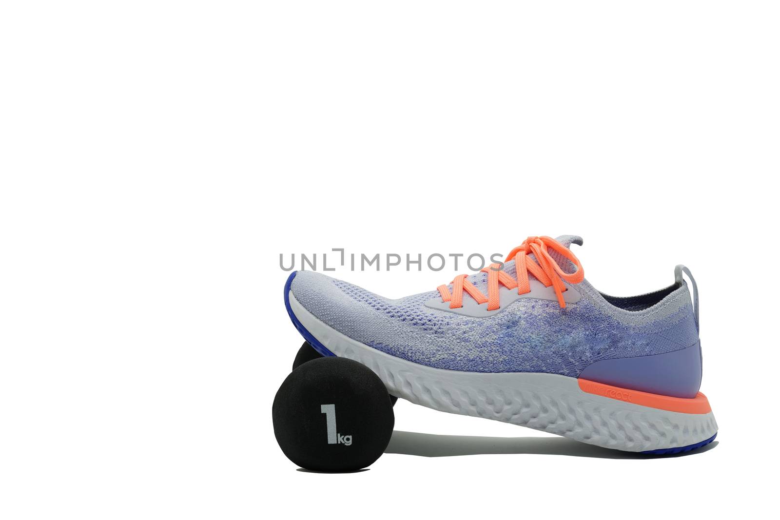 Sport shoe and dumbbell on isolated white background ,side,with  by VacharapongW