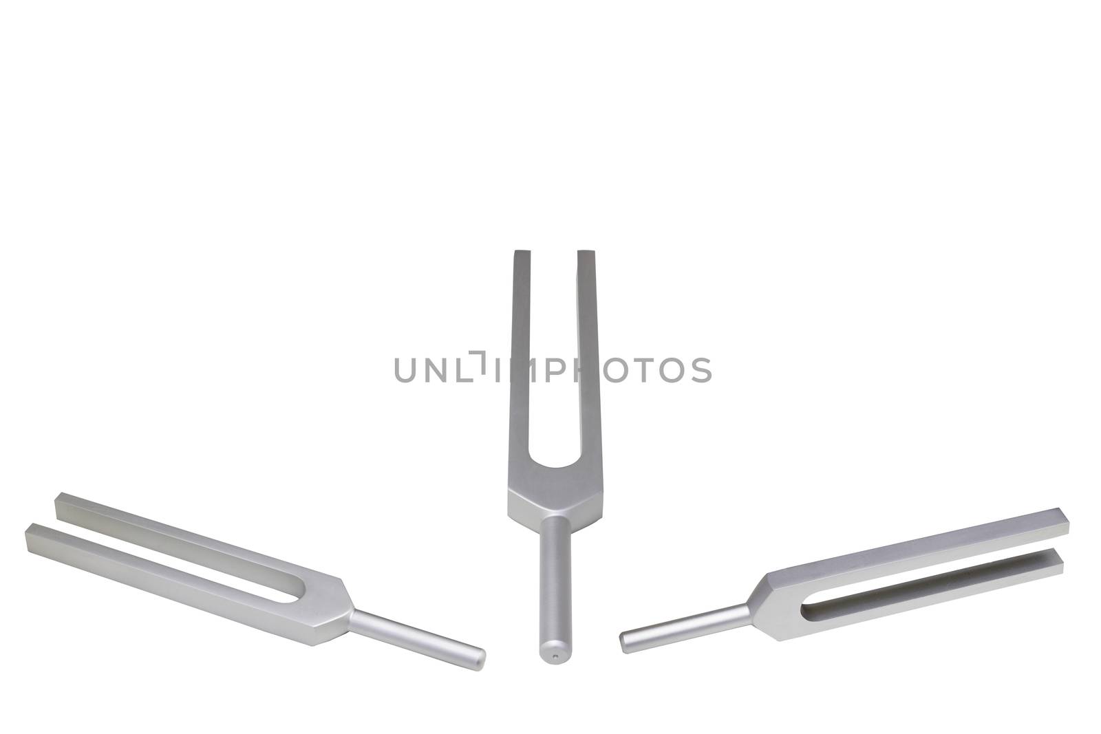 Tuning fork in variety of position on isolated white background