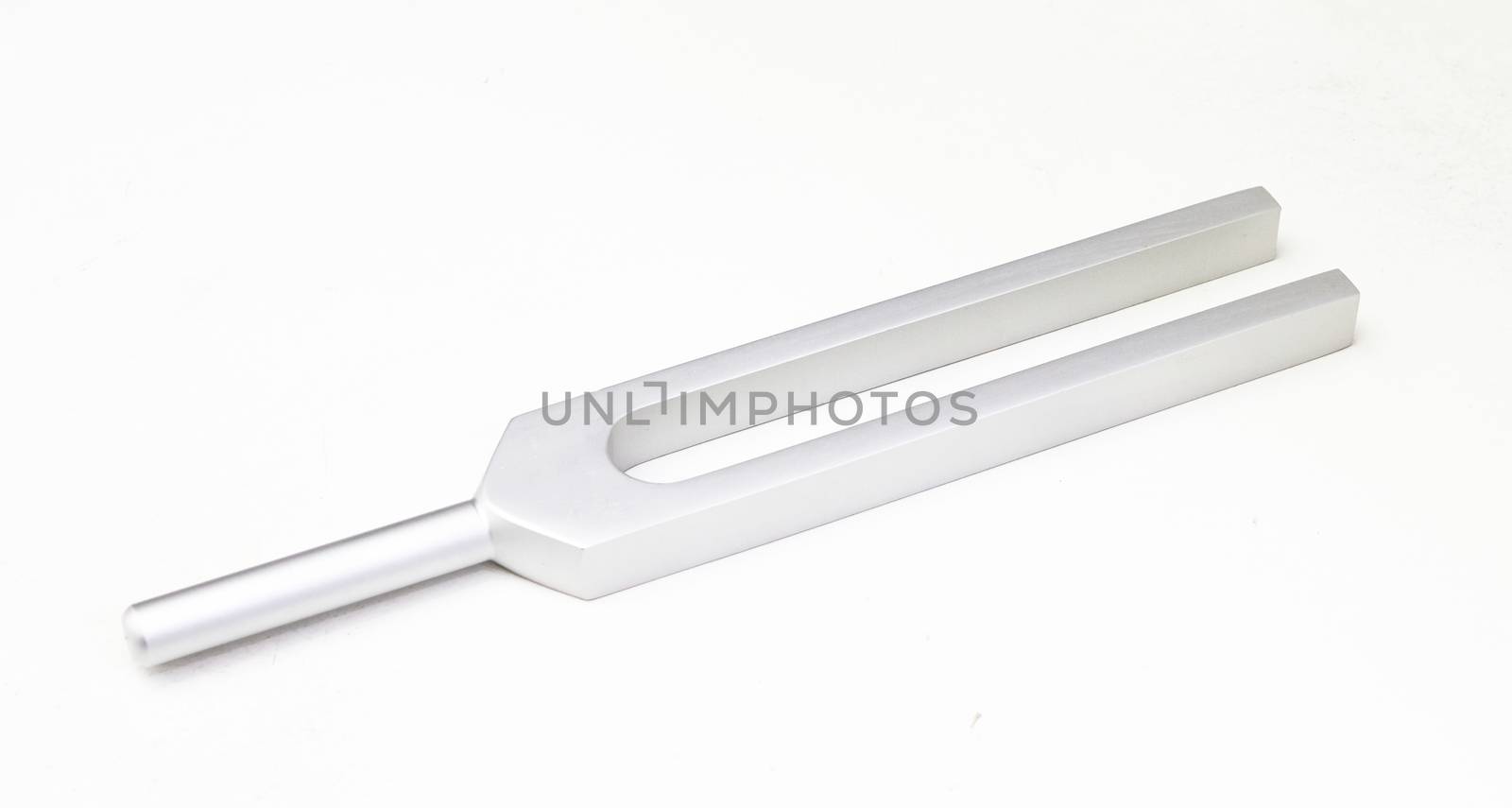 Tuning fork on white table