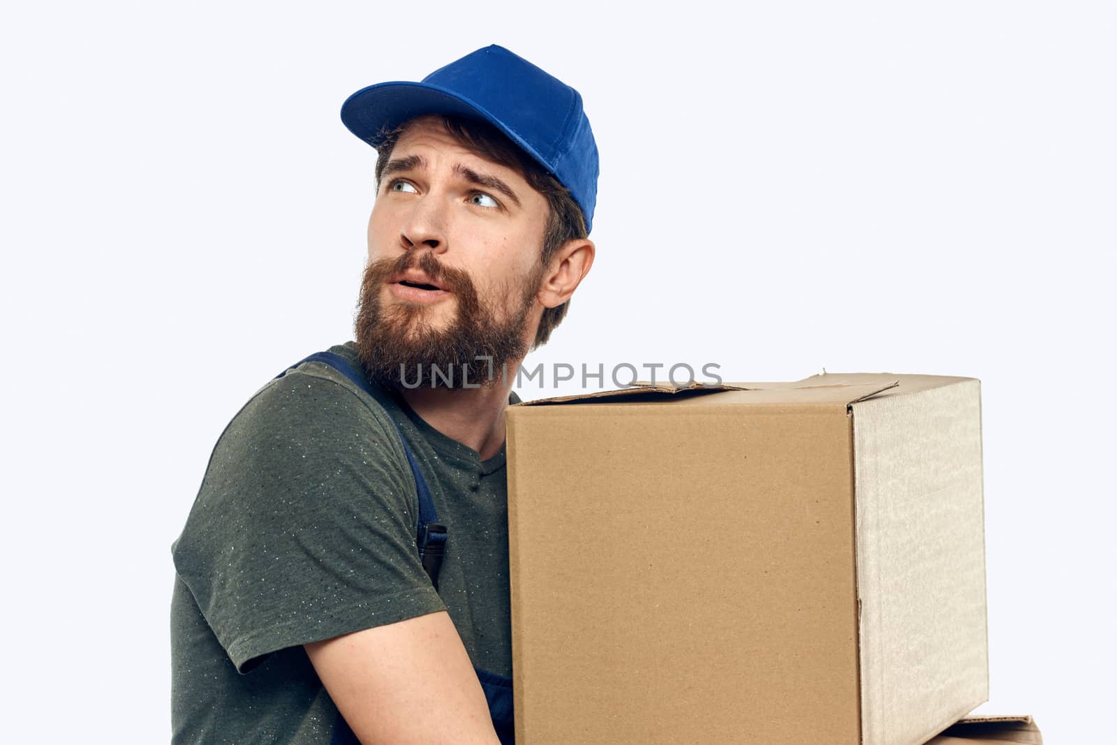 Working man with boxes in hands delivery service work lifestyle. High quality photo