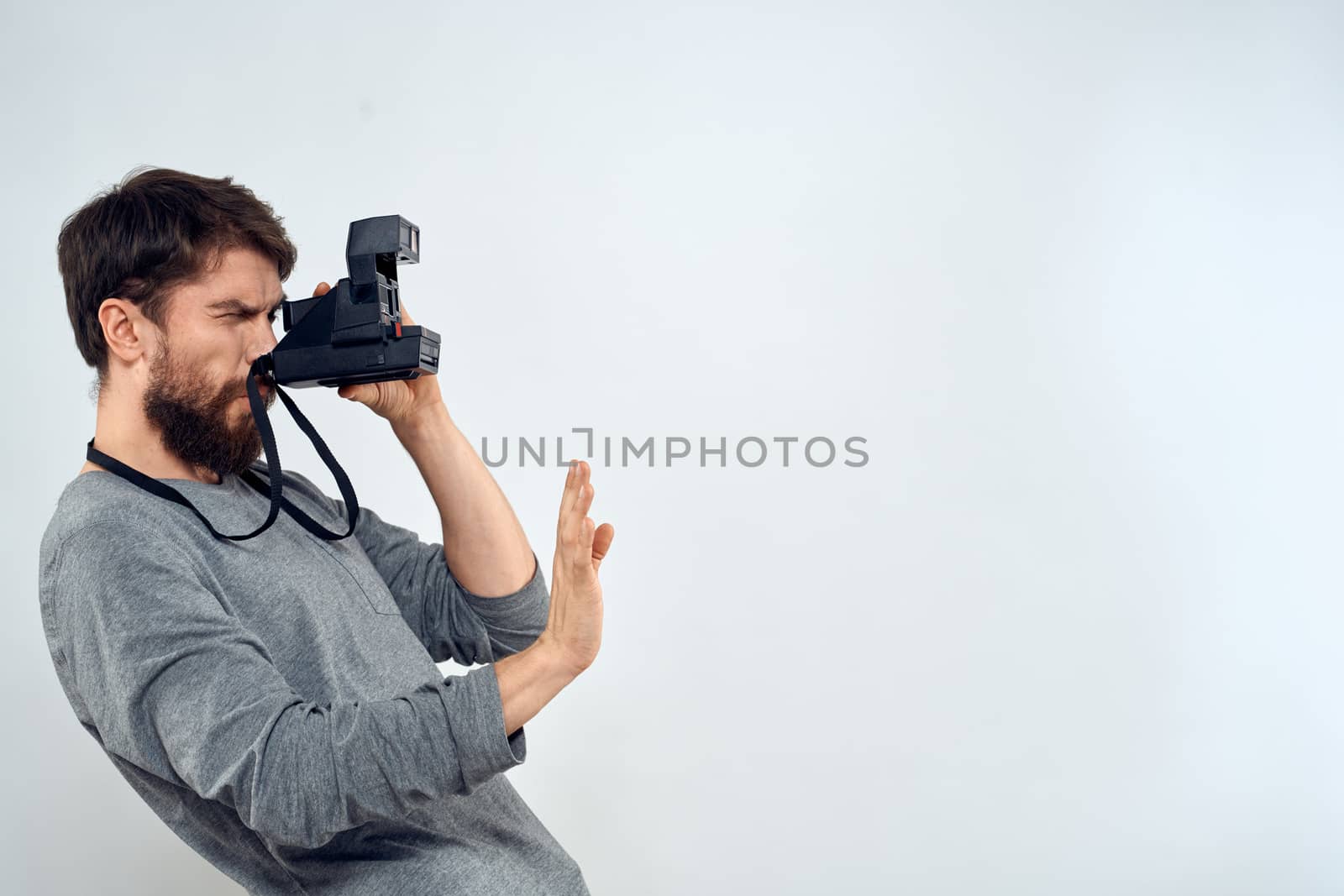 photographer with camera hobby technology studio lifestyle creative light background. High quality photo