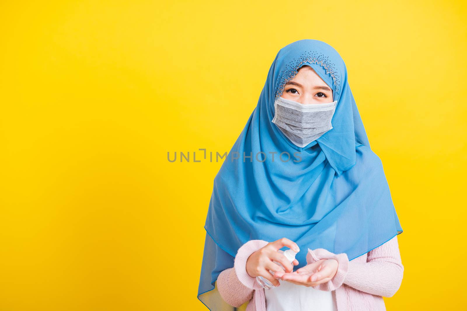 Asian Muslim Arab woman Islam wear veil hijab and face mask appl by Sorapop