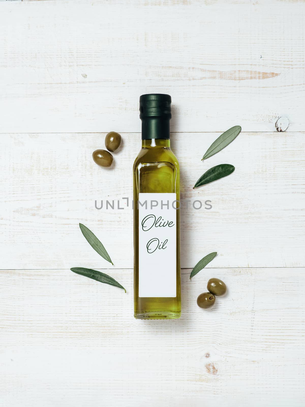 Olive oil glass bottle mock up, top view by fascinadora