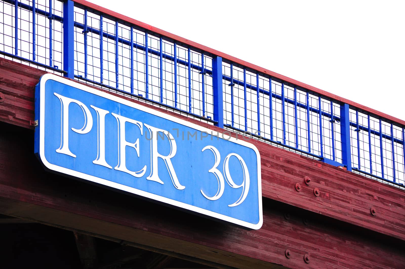 Pier 39 sign on flyover. Pier 39 is a shopping center and popular tourist attraction built on a pier, in Fisherman's Wharf in San Francisco, California.