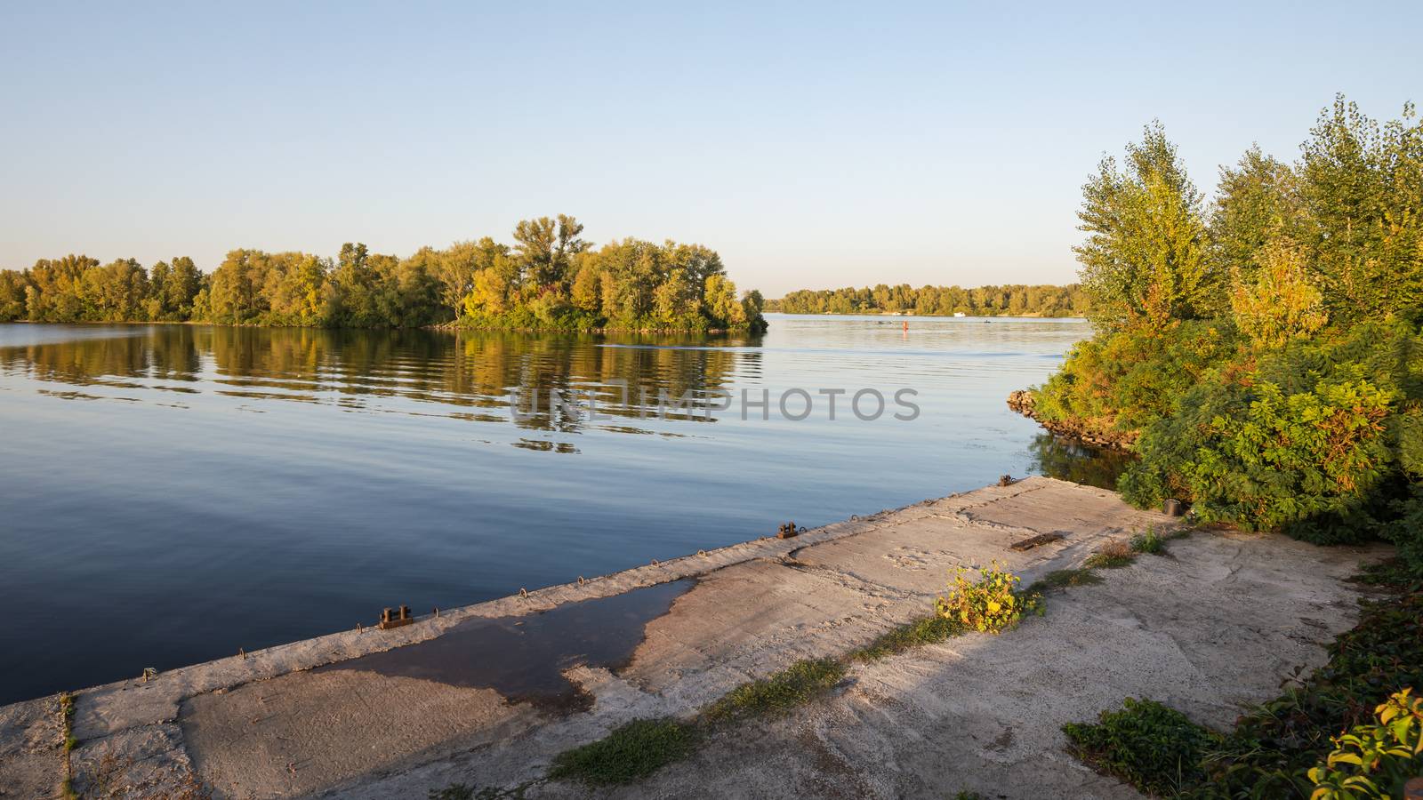 Landing stage on the Dnieper river in the Obolon district of Kiev, Ukraine, during a sunny summer evening