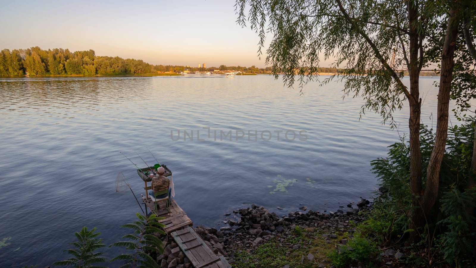 Kiev / Ukraine - September 22, 2020 - Fisherman on the Dnieper River in Kiev, Ukraine during a nice sunny afternoon of summer
