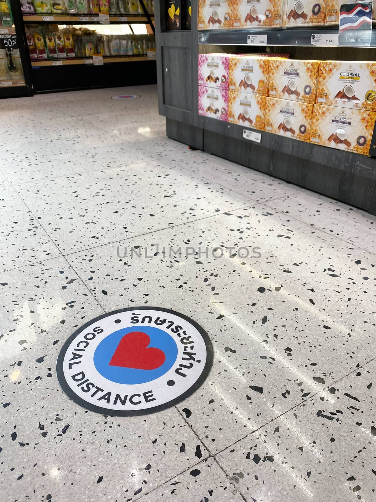 sign of social distance on floor in Gourmet Market of the EmQuartier, Bangkok as pandemic influenza precautions procedure during Covid-19 situation