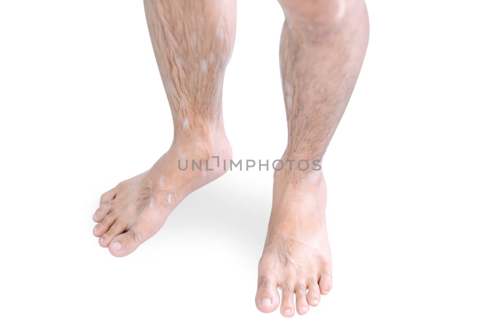 Close up man legs with taking a shower isolated on white background, health care and beauty