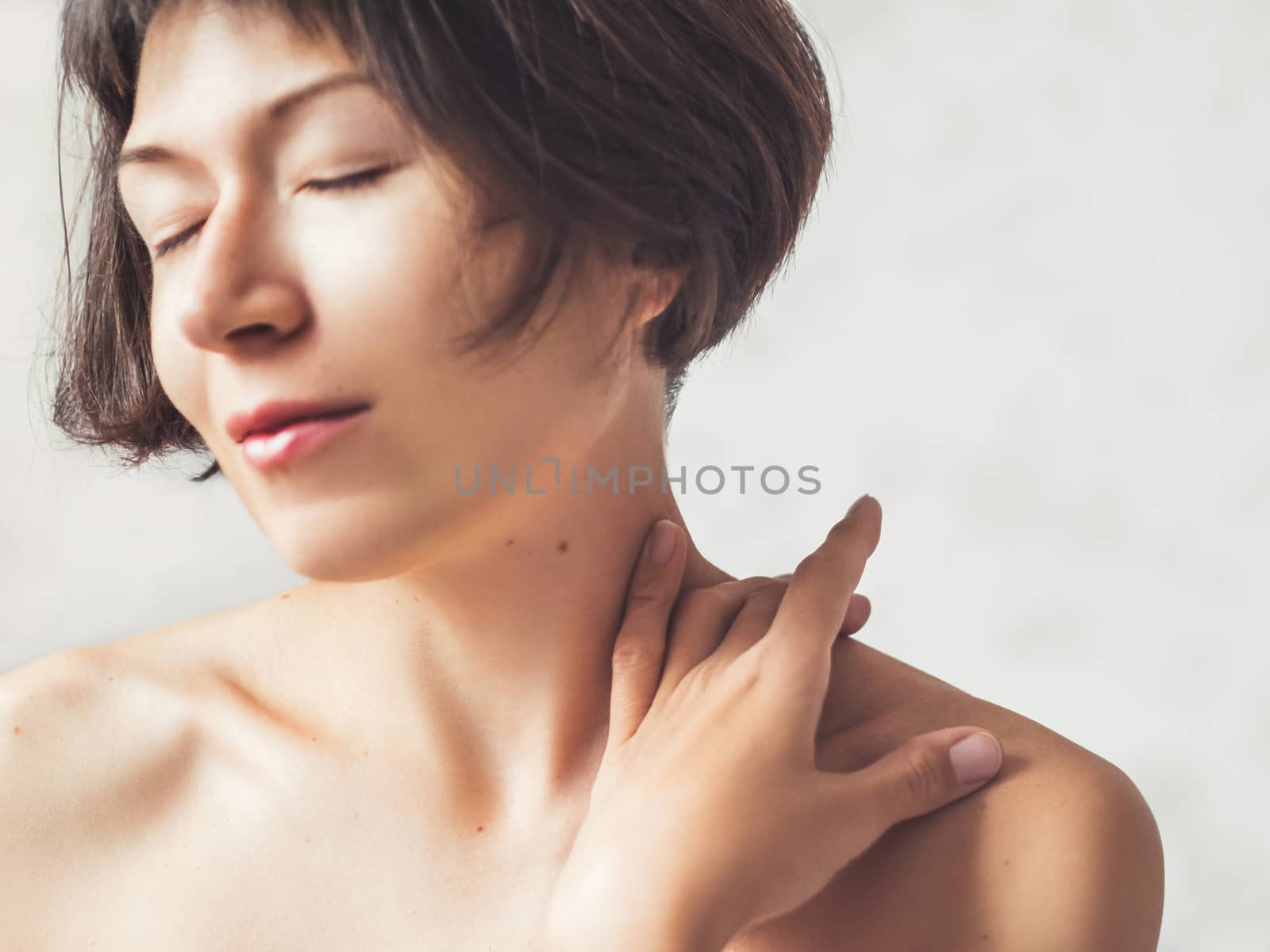 Close up portrait of woman on white background. Natural beauty without make up.