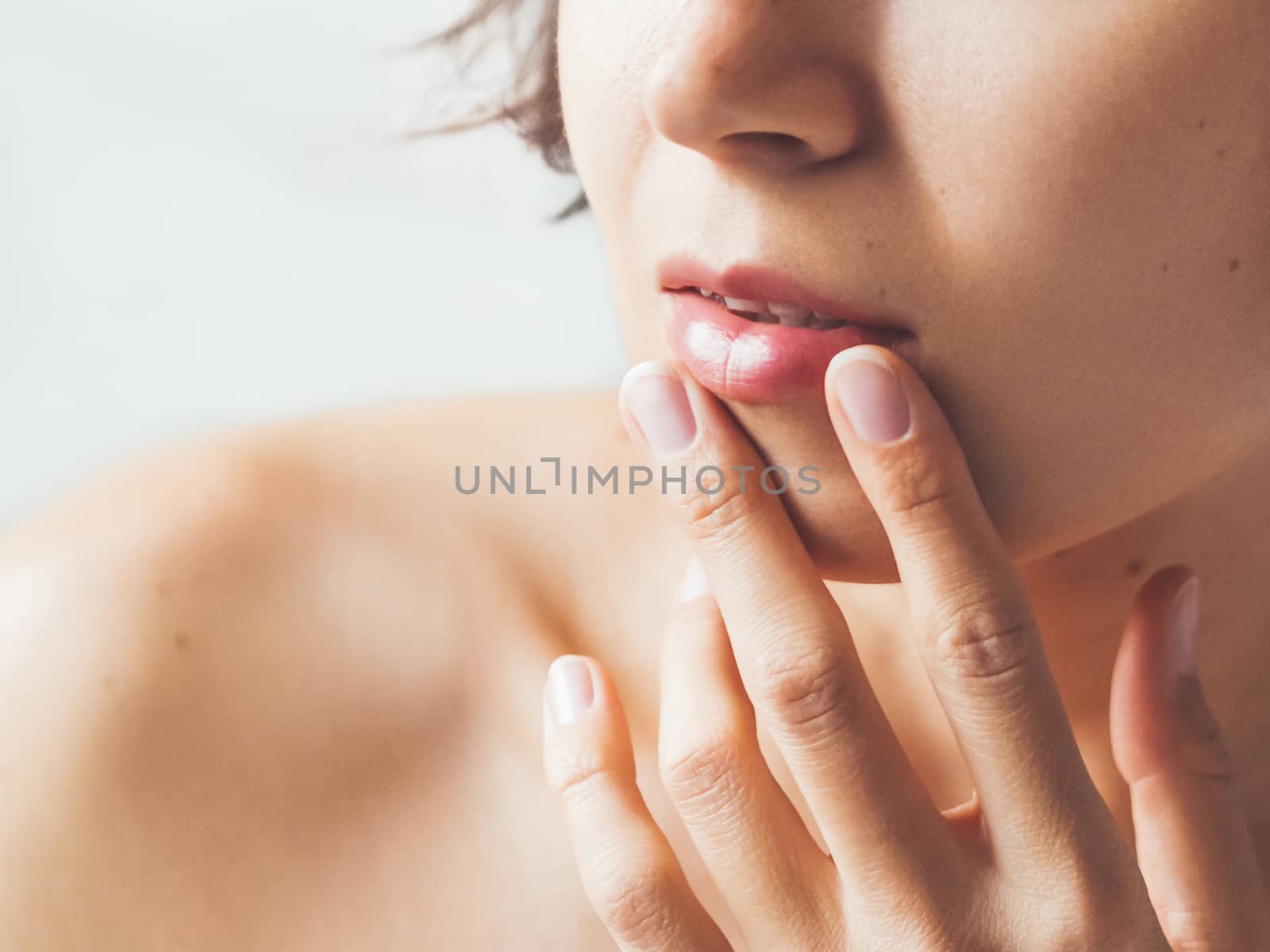 Close up portrait of woman on white background. Natural beauty without make up.