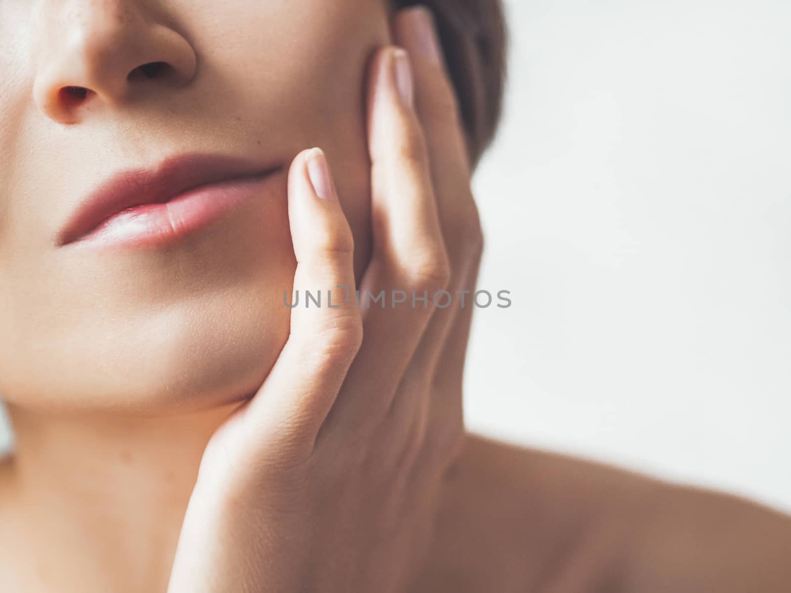 Close up portrait of woman on white background. Natural beauty w by aksenovko