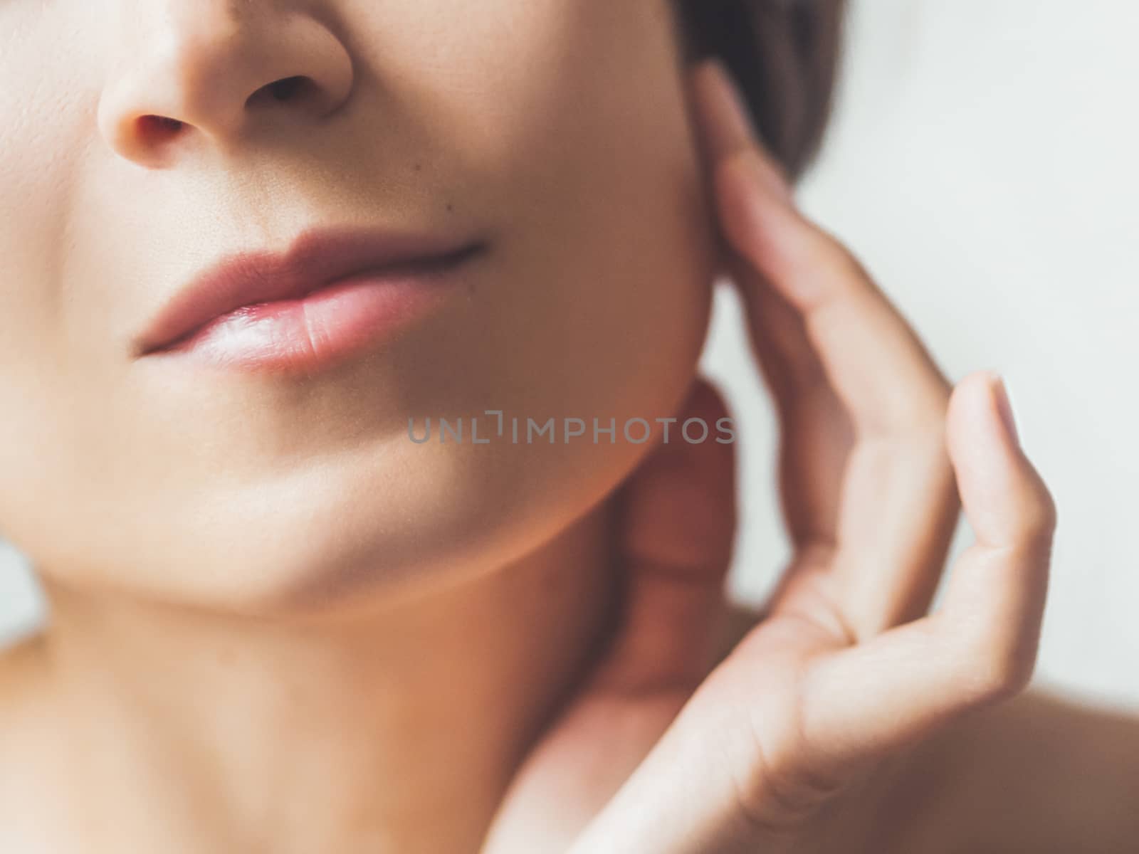 Close up portrait of woman on white background. Natural beauty without make up.