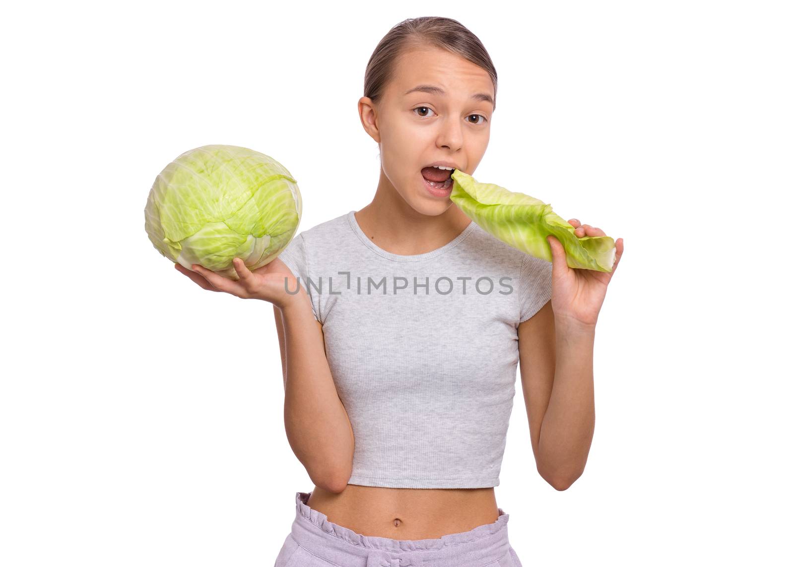 Beautiful young teen girl holding fresh green cabbage, isolated on white background