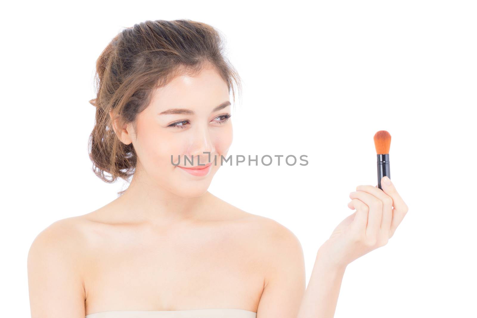 Beauty asian woman applying make up with brush of cheek isolated on white background, beautiful of girl holding blusher, skincare and cosmetic concept.