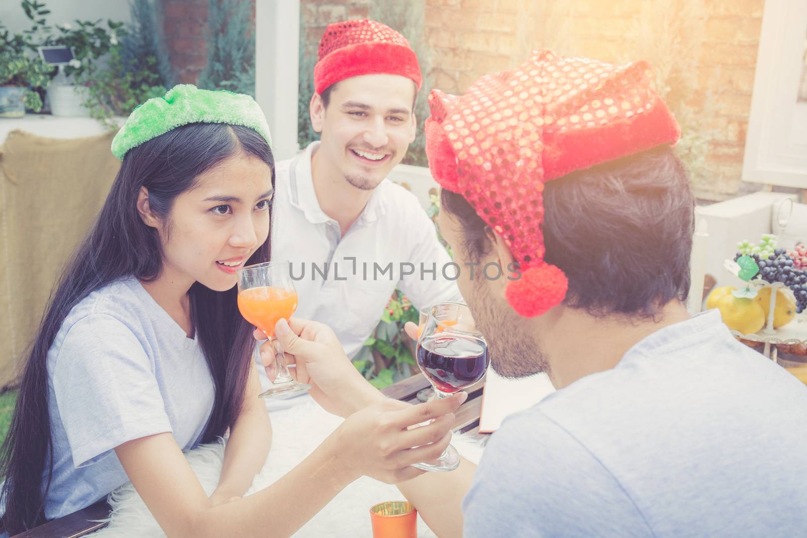 Asian group people man and woman drink and celebration at party outdoor. group of friends social event with beverage on hand with achievement, festive concept.