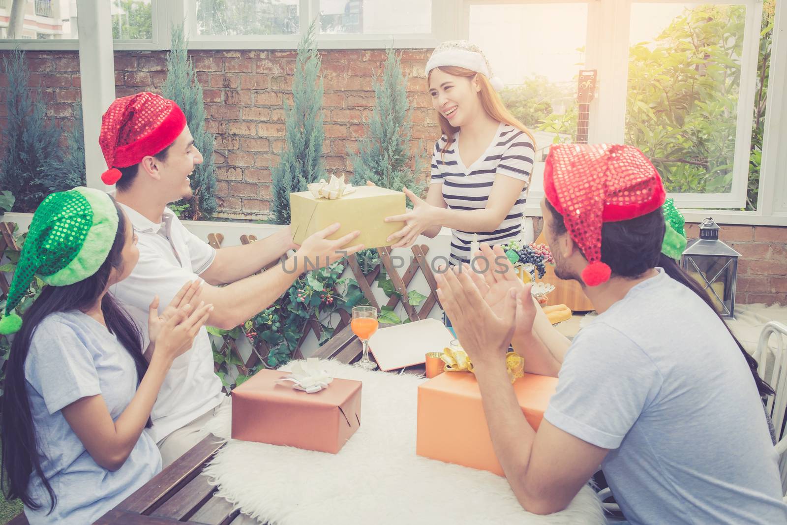 Asian group people man and woman giving gift box and celebration by nnudoo