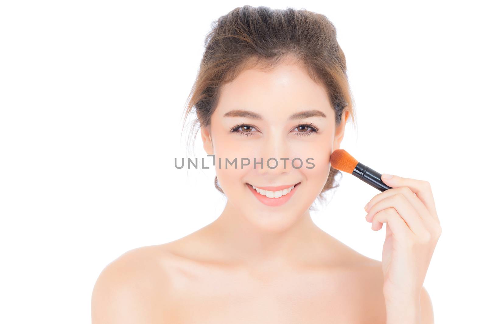 Beauty asian woman applying make up with brush of cheek isolated on white background, beautiful of girl holding blusher, skincare and cosmetic concept.