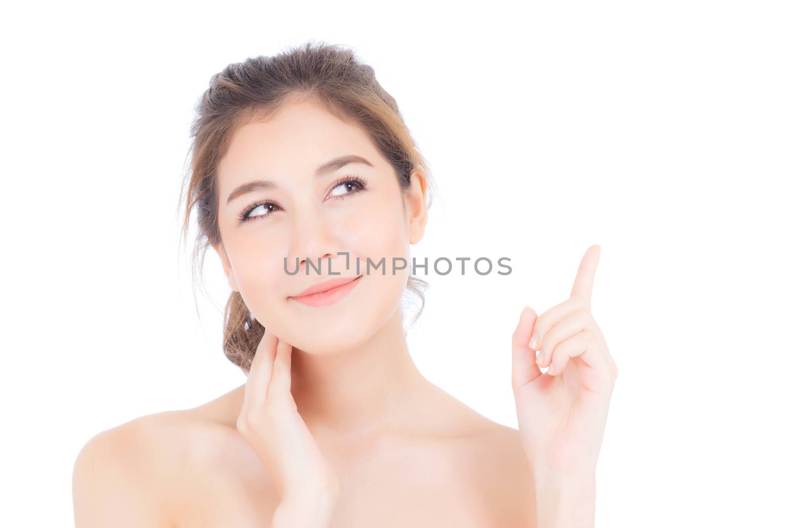 Portrait of beautiful asian woman makeup of cosmetic, beauty of girl with face smile and finger point something attractive isolated on white background, perfect with wellness and healthcare concept.