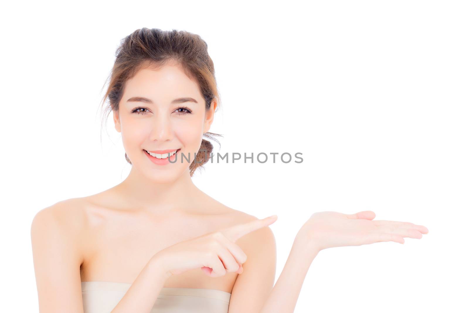 Asian beautiful young woman showing with healthy clean skin presenting something empty copy space on the hand isolated on white background, beauty concept.