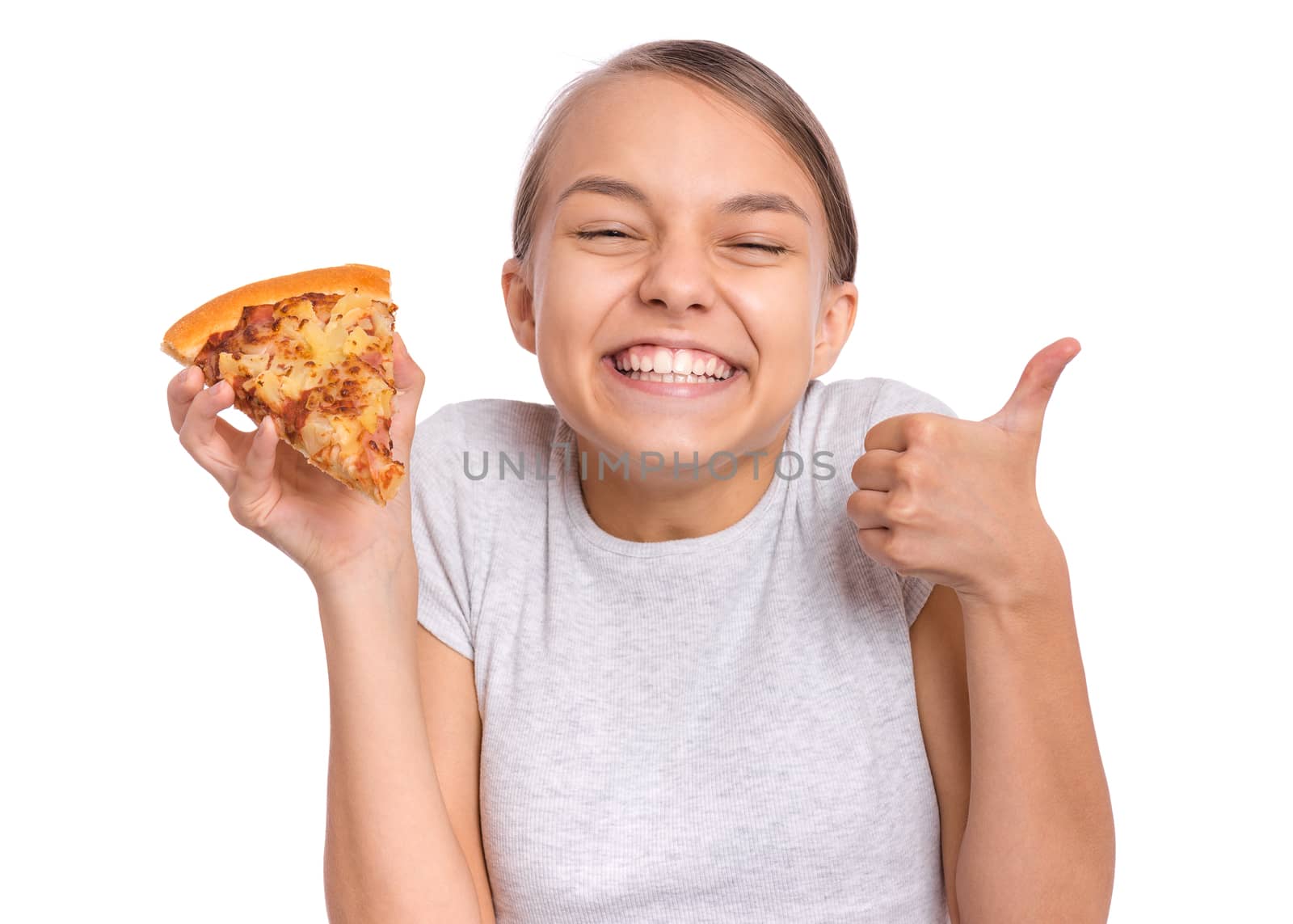 Happy beautiful young teen girl holds slice of pizza and making thumb up gesture