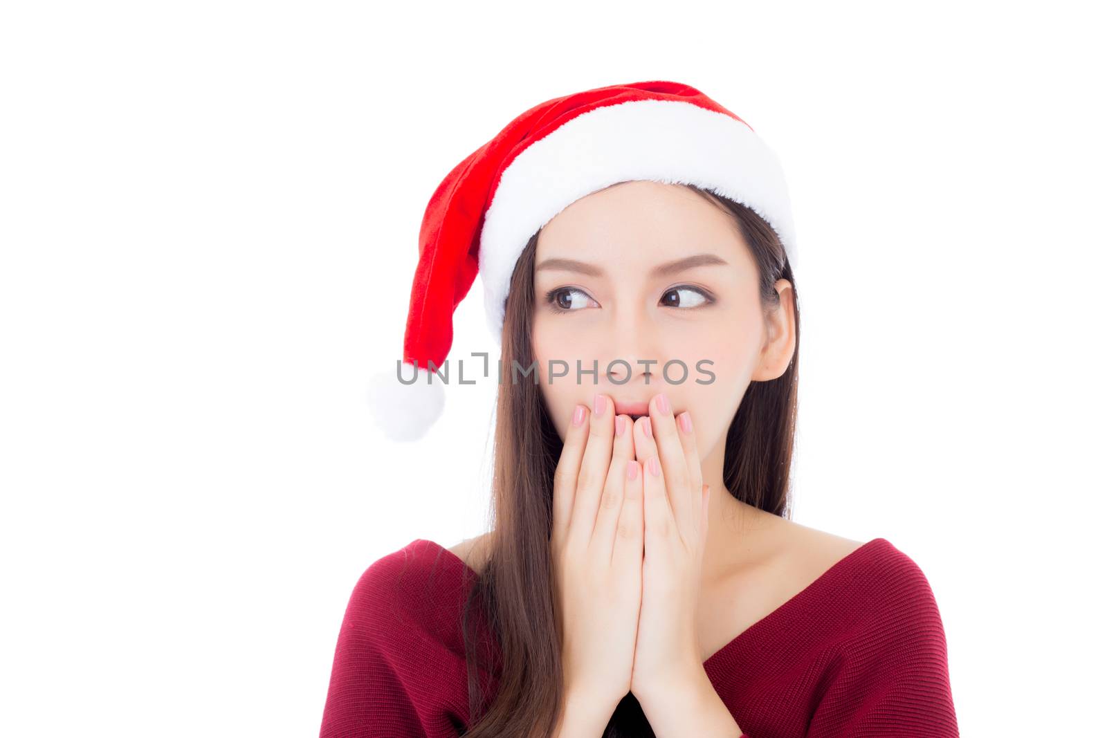 Portrait young asian woman wear santa hat with surprised and excited and covering mouth with christmas holiday isolated on white background, season xmas concept.
