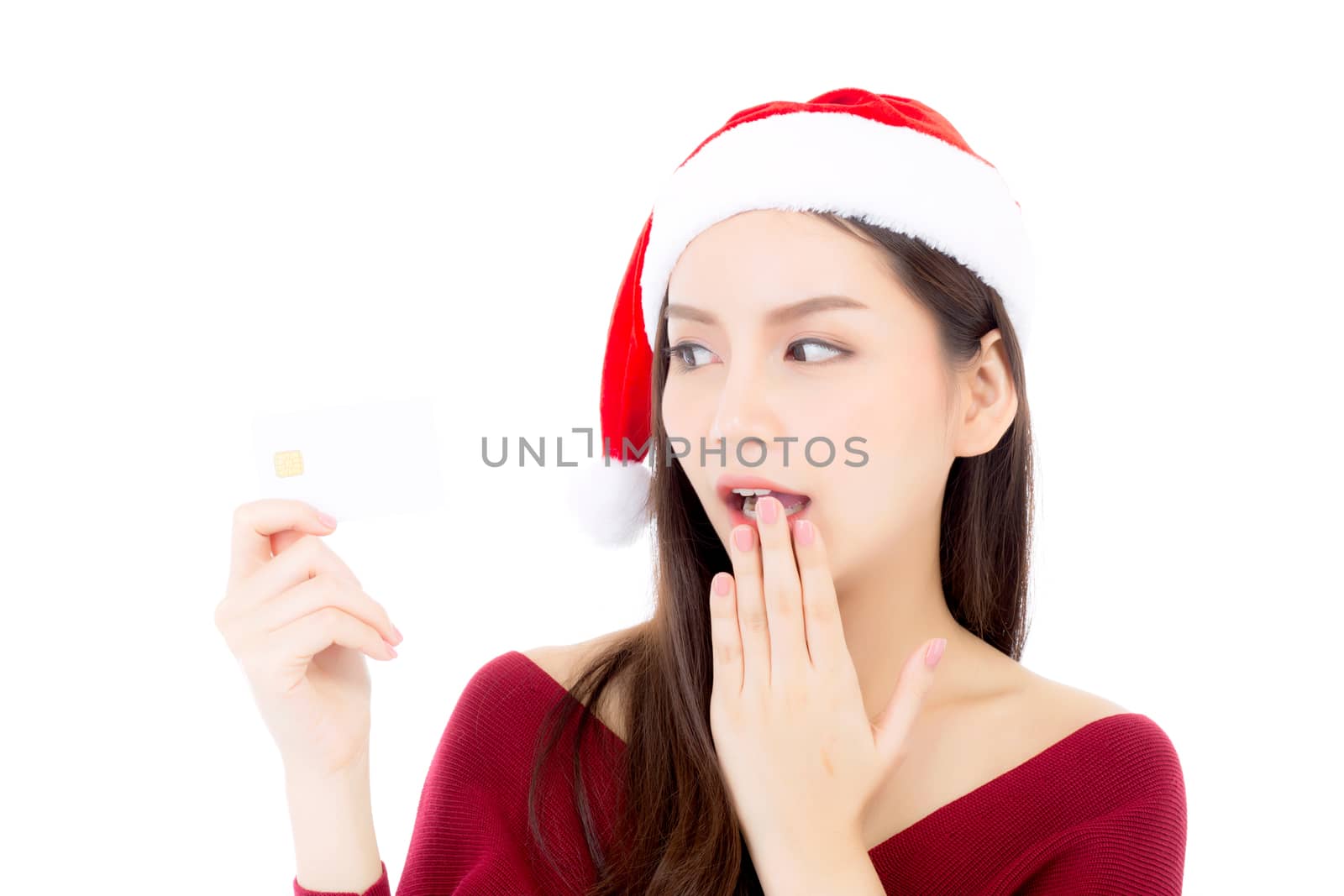 Portrait of beautiful asian young woman in santa hat smile holding credit card, girl have happy with shopping isolated on white background, christmas and holiday concept.
