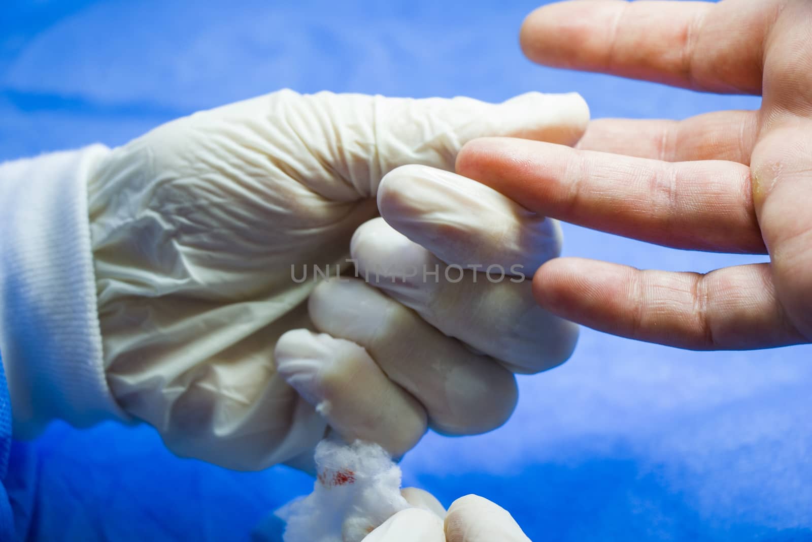 Insulin testing process, blood test and syringe. Injection in the hand. Patients and doctor. Studio shoot.