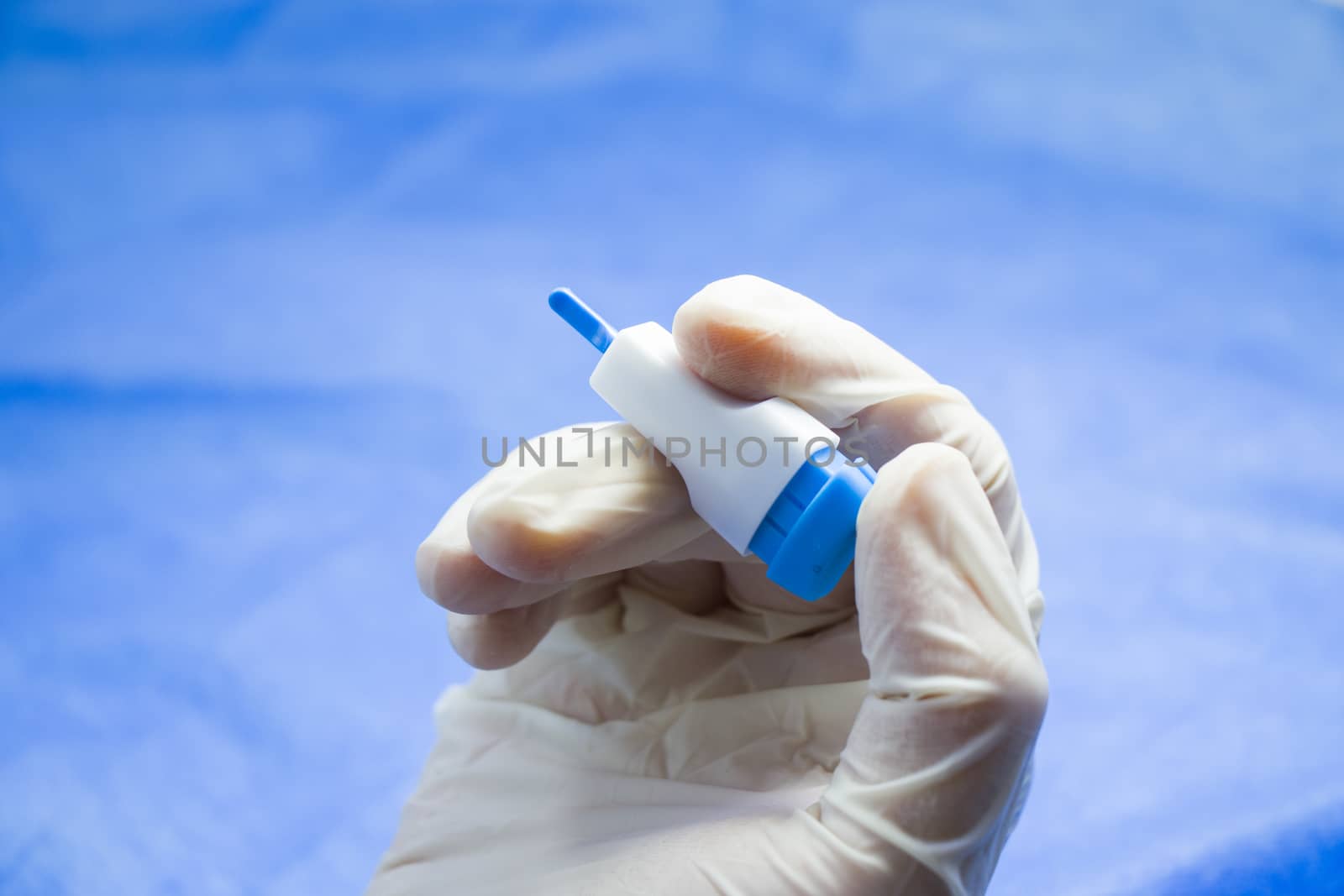 Insulin testing process, blood test and syringe. Injection in the hand. Patients and doctor. Studio shoot.