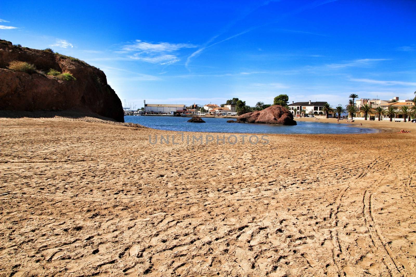 Mazarron, Murcia, Spain- October 3, 2019: Beautiful La Ermita beach in Mazarron, Murcia, Spain. Island in the background.