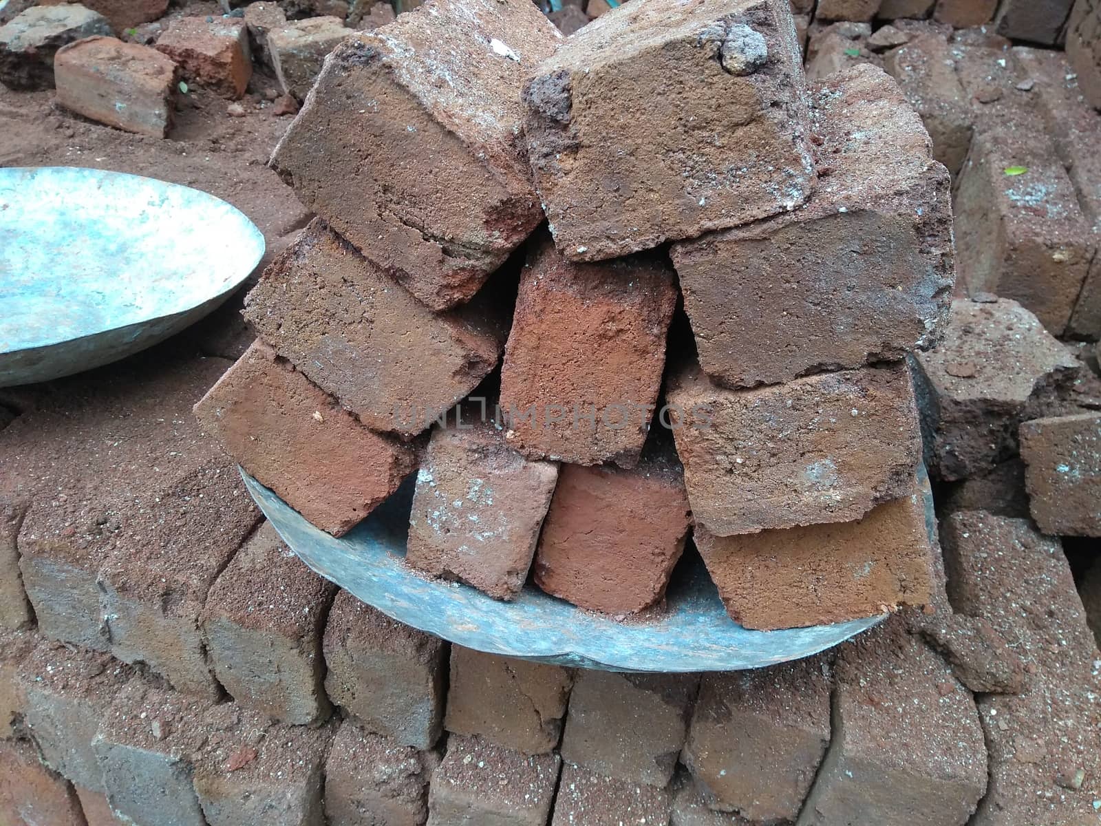dry red clay bricks for building construction work . with put