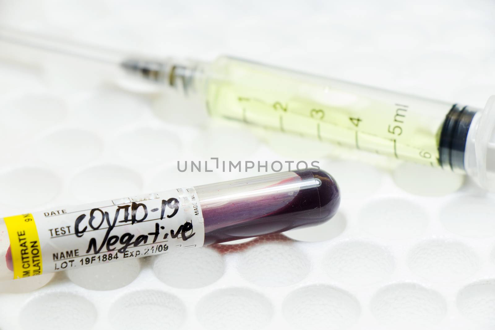 Medical needle and blood tube, corona virus or covid-19 vaccine. Close-up and studio shoot.