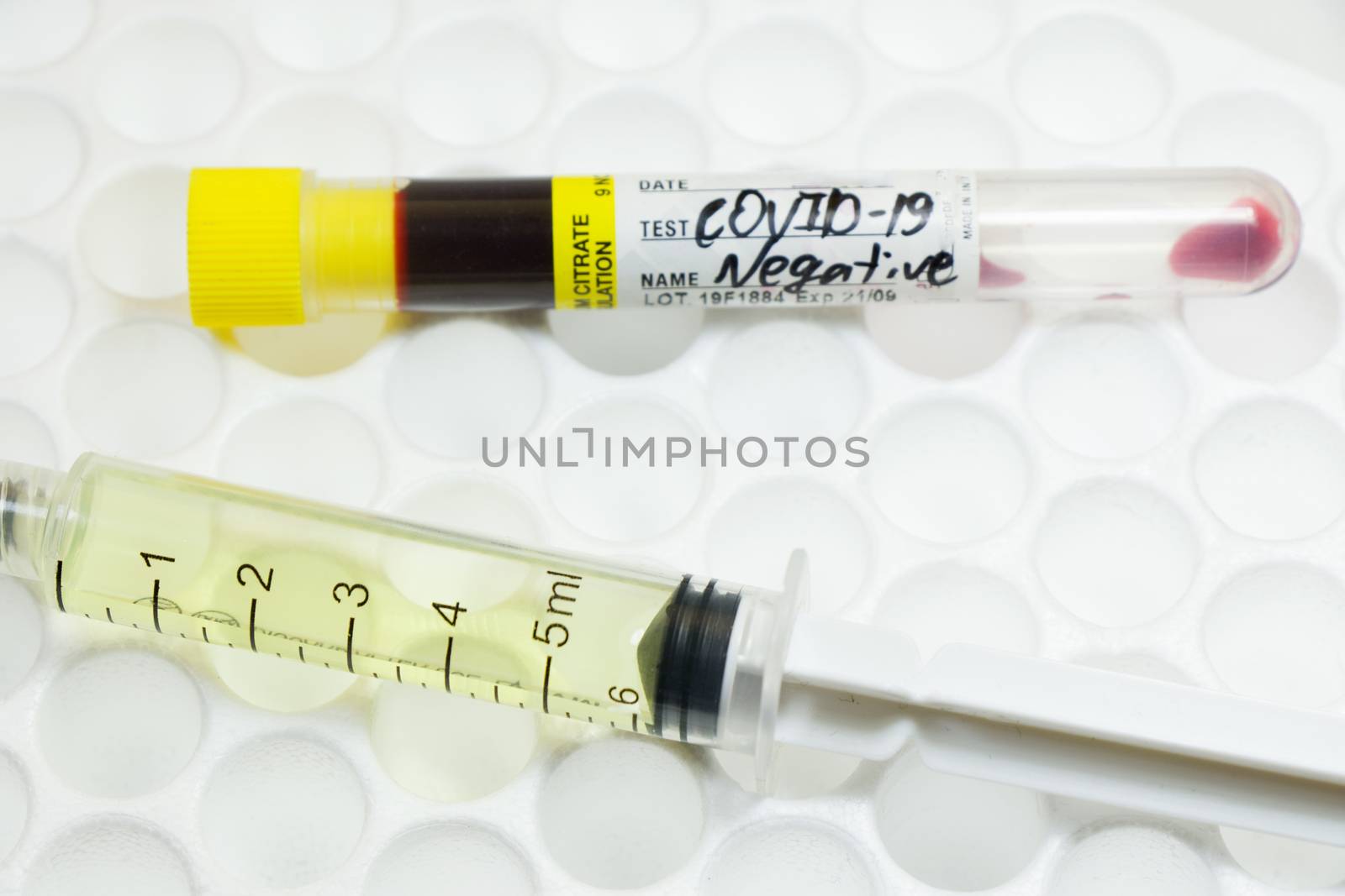 Medical needle and blood tube, corona virus or covid-19 vaccine. Close-up and studio shoot.