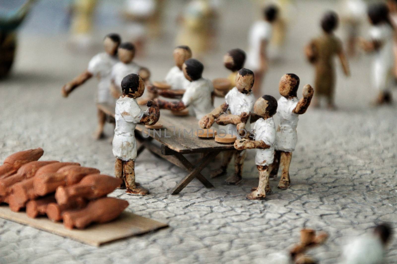 Cartagena, Murcia, Spain- July 27, 2019: Miniature roman figurines displayed in a Cartagena Museum reflecting daily life in roman times