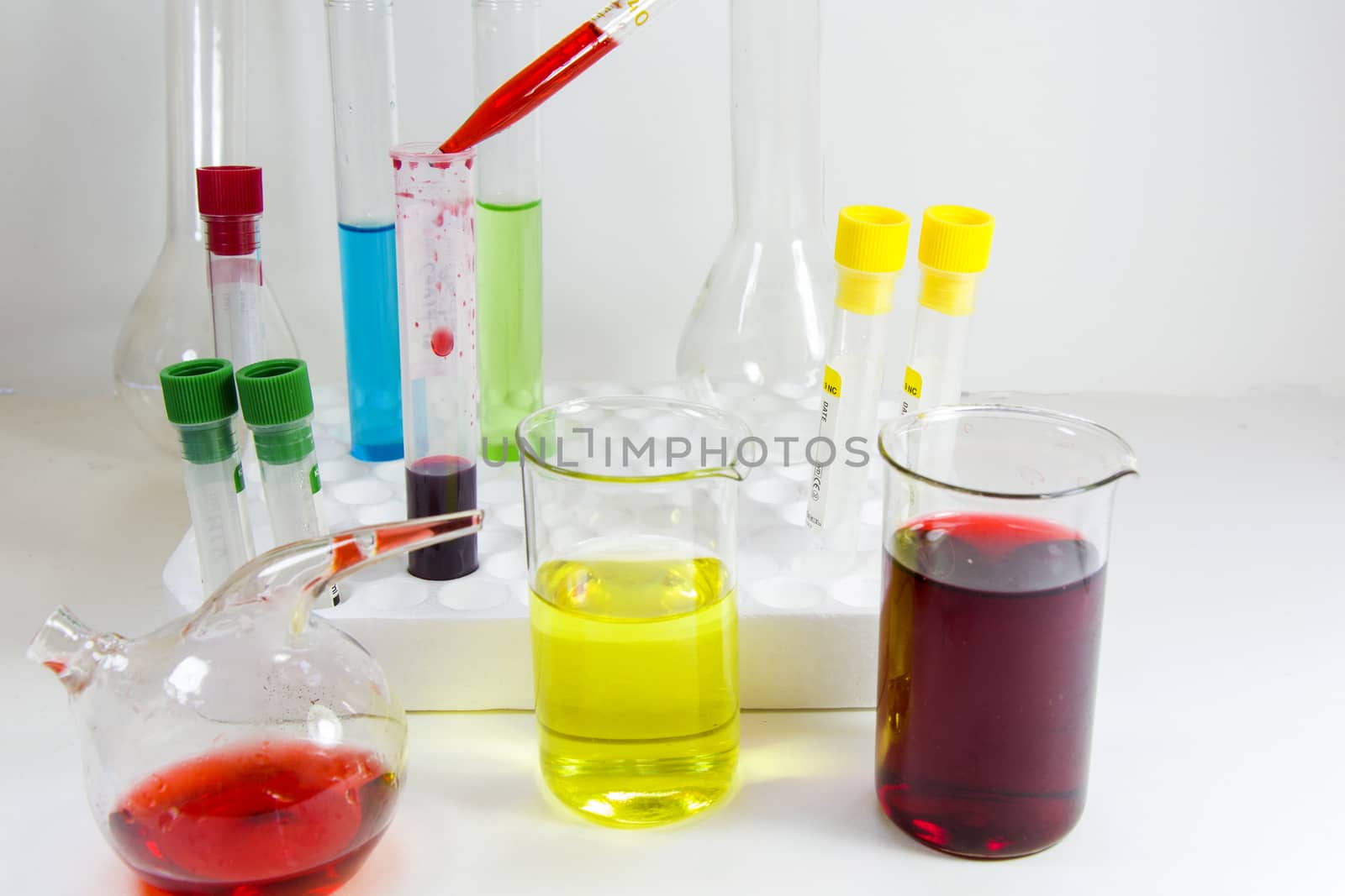 Laboratory chemical liquid elements and research diagnoses, instruments and objects in the sterile table, glassware and pipette. Studio shoot.