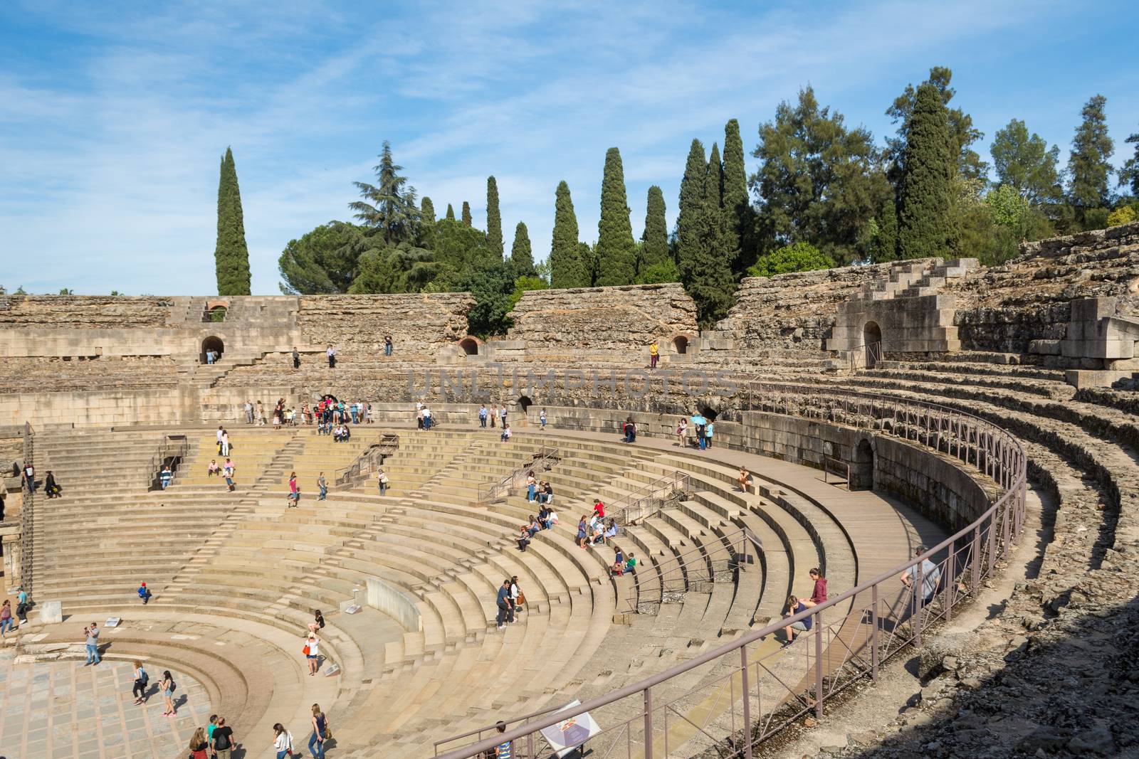 Merida, Spain, April 2017, tourists visiting the Roman ruins theatre arena & waiting rooms used for gladiator & animal fights. Travel and tourism.